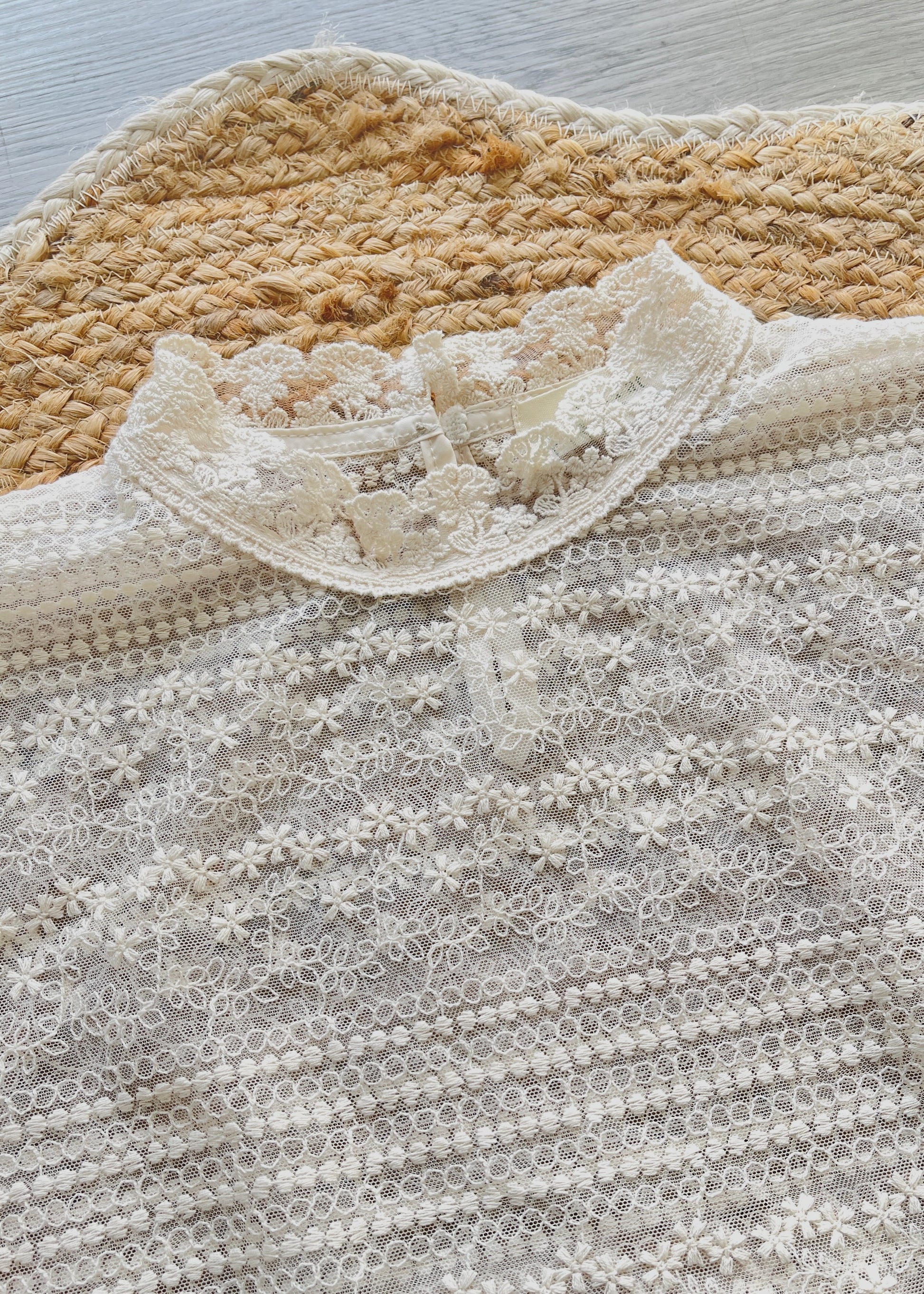 White lace top with flounce sleeves and mock neck