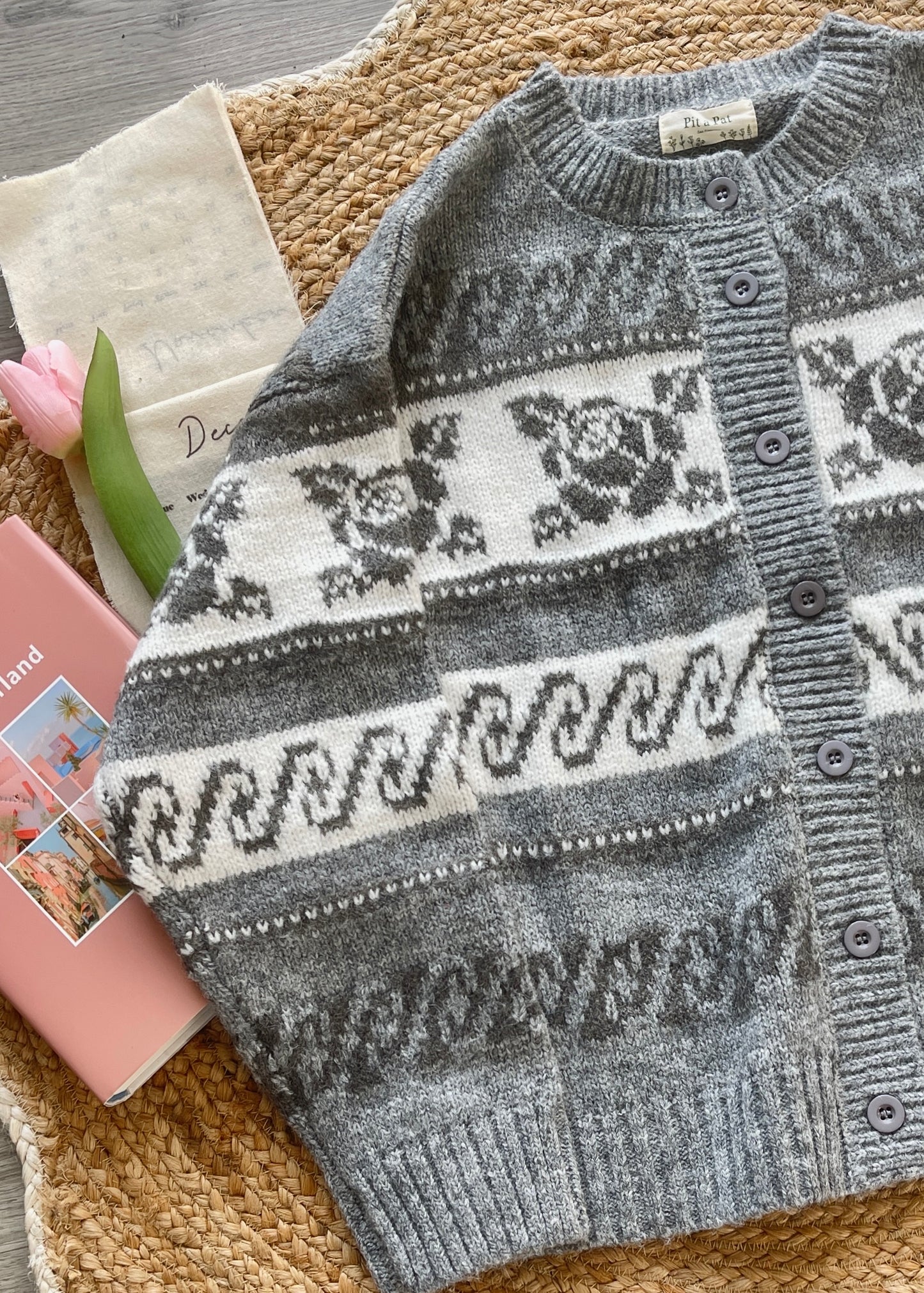 Gray and white patterned sweater 