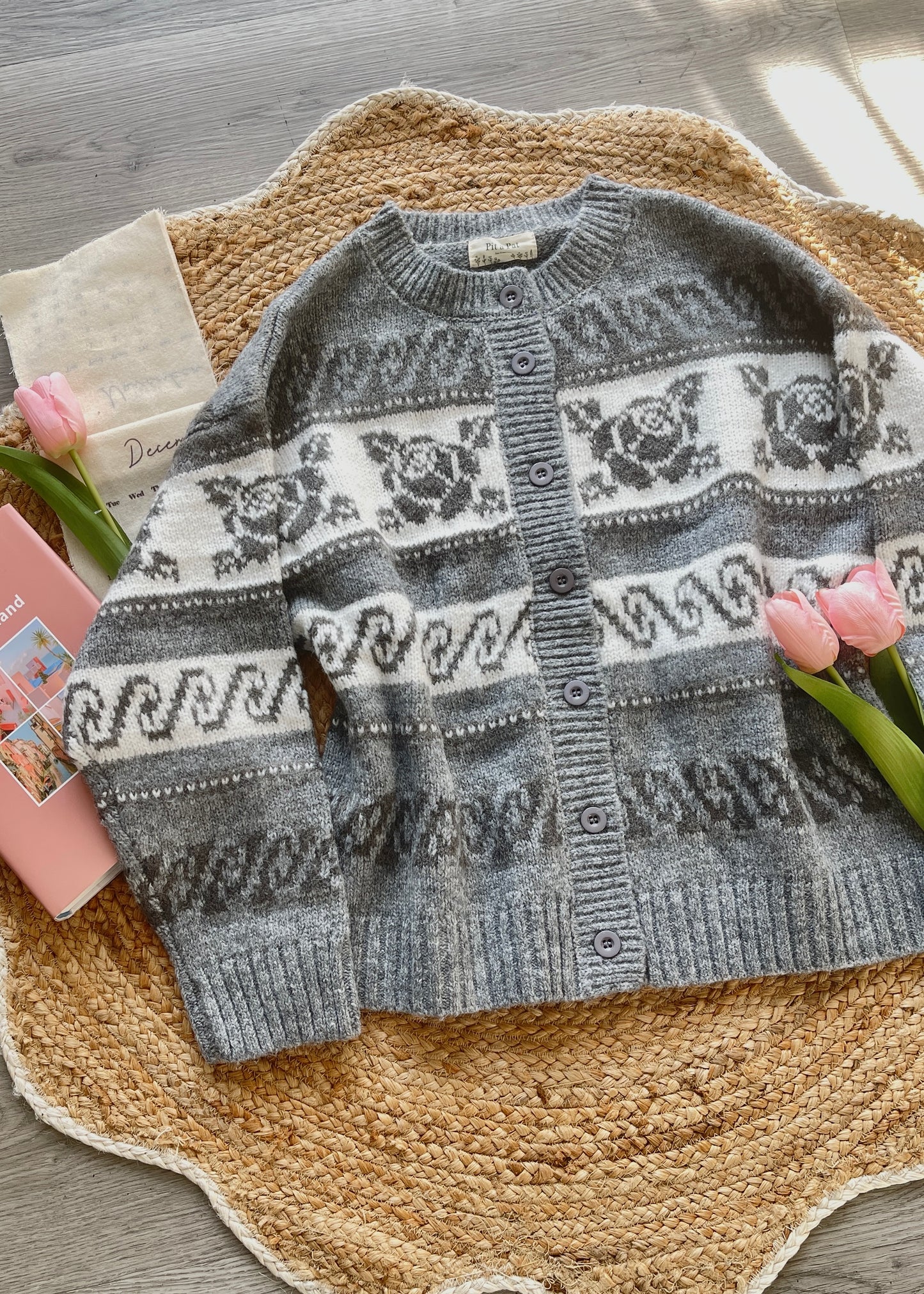 Gray and white patterned sweater 