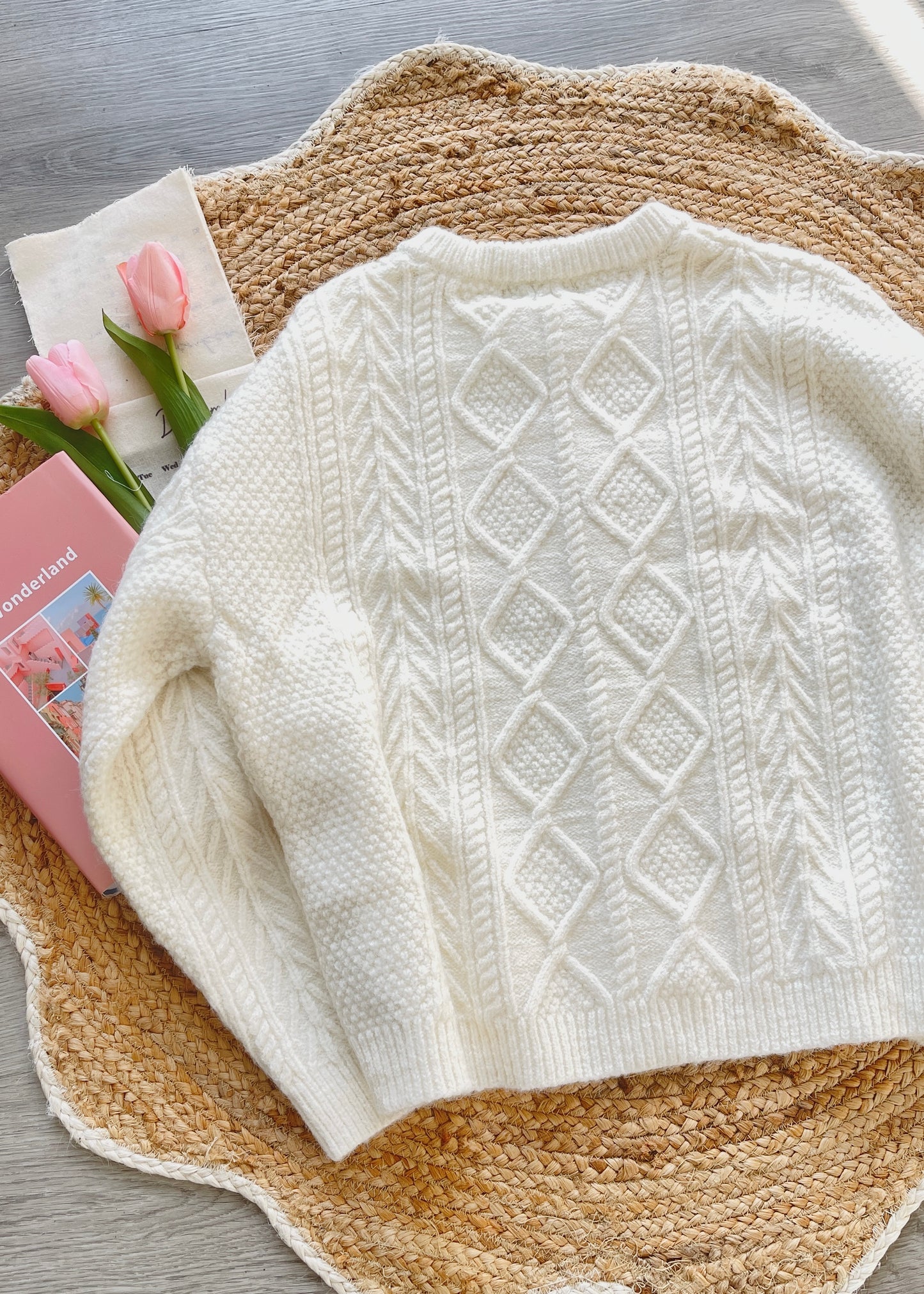 White knitted sweater with crochet flowers's back